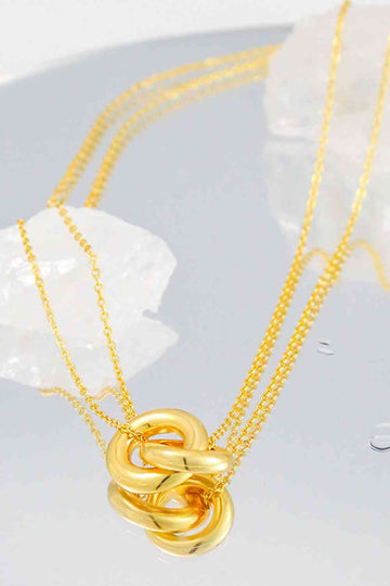 Collier chaîne avec pendentif à anneau lié